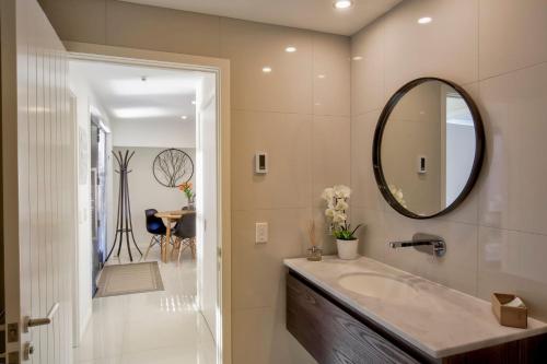 a bathroom with a sink and a mirror at Bluewater Views in Queenstown
