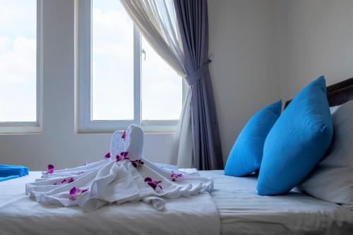 Ένα ή περισσότερα κρεβάτια σε δωμάτιο στο Phong Lan 2 Hotel