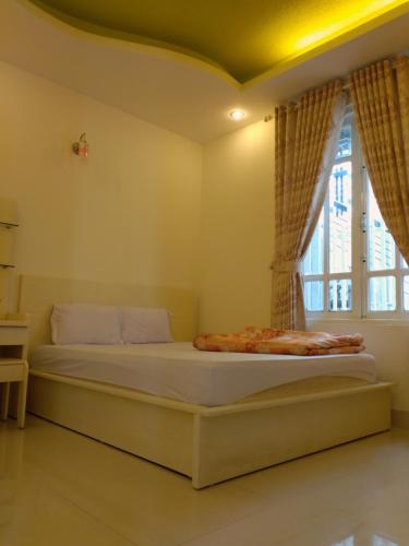 Giường trong phòng chung tại Coc Coc Hostel