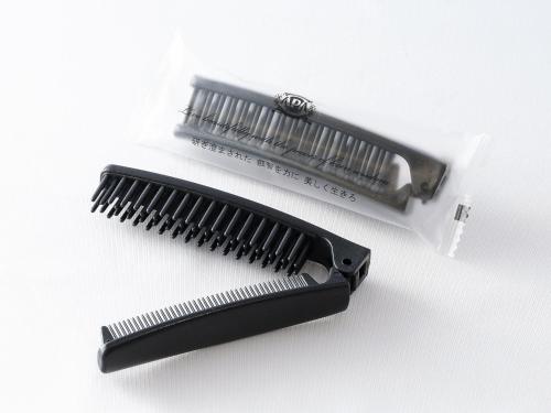 a black comb and a white plastic bag at APA Hotel Miyazaki Miyakonojo Ekimae in Miyakonozyō