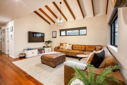a living room with a couch and a table at Starboard Drift in Margaret River Town