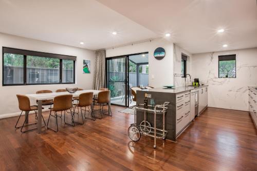 a kitchen and dining room with a table and chairs at Starboard Drift in Margaret River Town