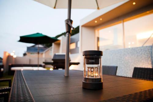 a glass coffee cup sitting on top of a table at 天草三角シーサイドヴィラ in Uki