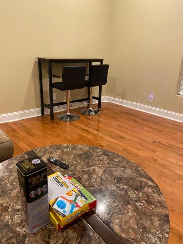 a living room with a table and a counter top at Modern 3-bedroom, big fence yard, Pets stay free in Durham