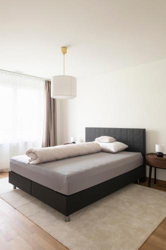 a bedroom with a bed in a room at Senevita Ahornpark in Bätterkinden
