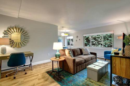 a living room with a couch and a table at Modern Coastal Downtown, King bed, Work Desk, Kitchen in Seattle