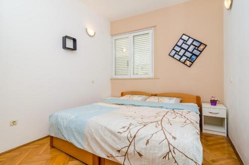 Postel nebo postele na pokoji v ubytování Apartments 4M