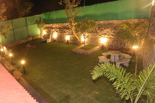an image of a garden at night with lights at PINE VILLA GARDEN in Yercaud