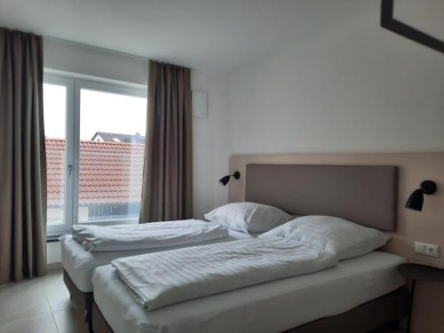 Ein Bett oder Betten in einem Zimmer der Unterkunft Hotel-Gasthof Obermeier