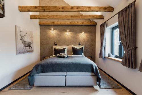 Ein Bett oder Betten in einem Zimmer der Unterkunft Asten-Chalets