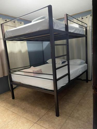 Un ou plusieurs lits dans un hébergement de l'établissement Be My Guest Cabinas