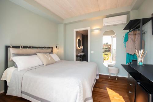 Ένα ή περισσότερα κρεβάτια σε δωμάτιο στο Camere Relais Filomare