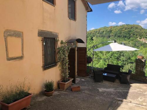a house with a view of the mountains at Morelliana4Rooms in Scansano