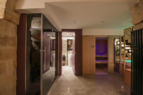 a hallway of a house with a refrigerator at SUITE & SPA VIA VENETO in Monopoli
