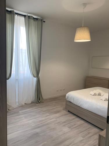 Postel nebo postele na pokoji v ubytování CASA 8 GIUGNO