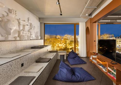 a hotel room with a view of a city at Zeus is Loose Hostel in Thessaloniki
