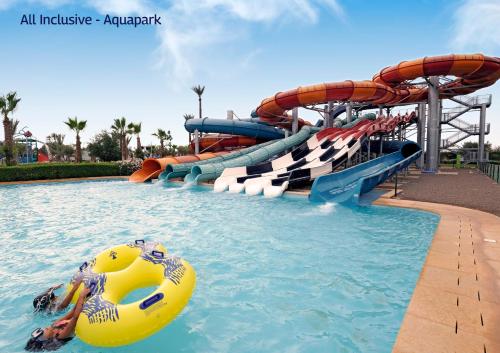 a water slide in a pool at a water park at Valeria Madina Club - All Inclusive in Marrakech