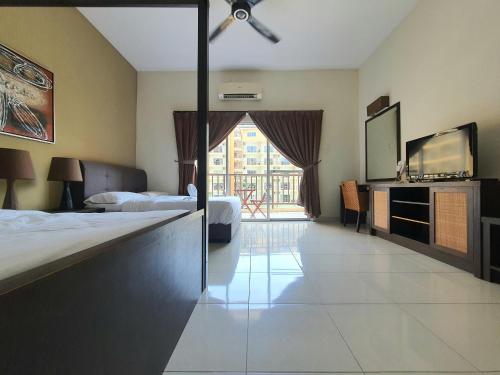 a hotel room with two beds and a large window at Gold Coast Morib Themepark View Studio in Banting