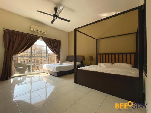 a bedroom with a large bed and a large window at Gold Coast Morib Themepark View Studio in Banting