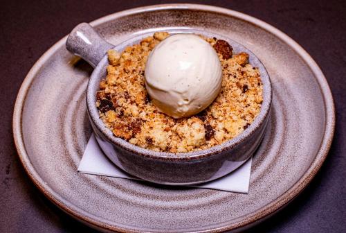 a bowl of food with a ice cream on a plate at Hillyard House Hotel in Castlewellan