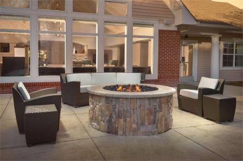 a fire pit in the middle of a patio at Sonesta ES Suites Raleigh Durham Airport Morrisville in Morrisville