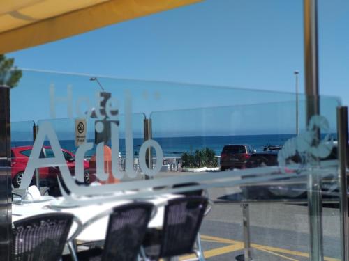 a view of a sign in a store window at Hotel Arillo in Noja
