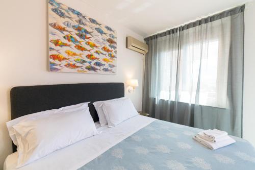 En eller flere senge i et værelse på Hotel Villino Gallodoro