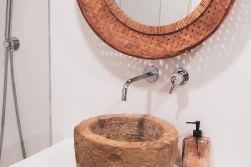 a bathroom with a wooden sink and a shower at Lobeira - Centenary country house and gardens in Beja