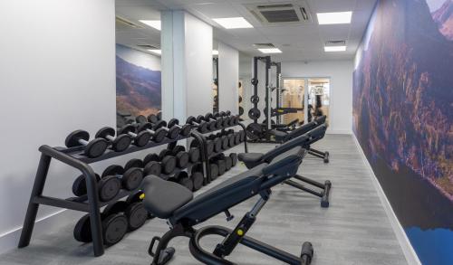 a row of exercise equipment in a gym at Springfield Hotel & Health Club in Halkyn