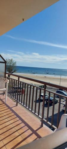a balcony with a view of the beach at Hotel Arillo in Noja