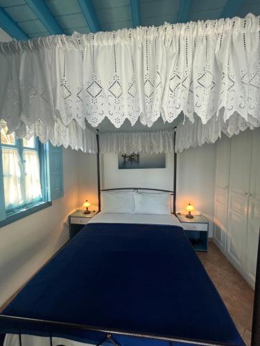 Ένα ή περισσότερα κρεβάτια σε δωμάτιο στο Patmos Villas