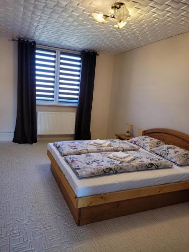 Postel nebo postele na pokoji v ubytování Apartmán Ellie Vysoké Tatry
