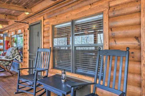 a dining room with two chairs and a table at The Lodge Nantahala River in Bryson City