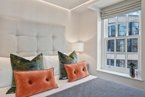 מיטה או מיטות בחדר ב-Hope House Residences by Q Apartments