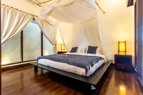 A bed or beds in a room at CASA PINARAK 1 I 3BR Private Villa near Seminyak