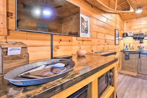 a kitchen with a large sink in a wooden cabin at The Lodge Nantahala River in Bryson City