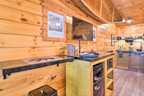 a kitchen with a counter in a wooden cabin at The Lodge Nantahala River in Bryson City