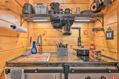 a kitchen with a stove and a counter top at The Lodge Nantahala River in Bryson City