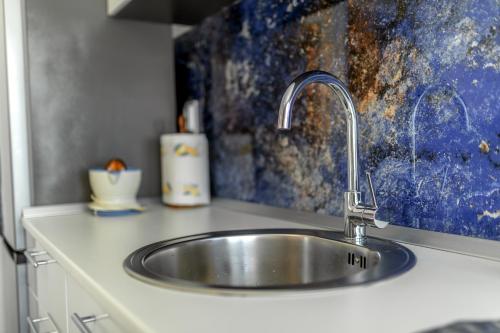 a kitchen sink with a faucet on a counter at barapartman_centar in Bar