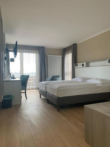 Ліжко або ліжка в номері Hotel Goor und Apartmenthaus
