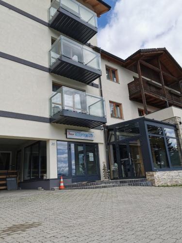 a building with balconies on the side of it at Alpengasthof Tanzstatt in Lachtal