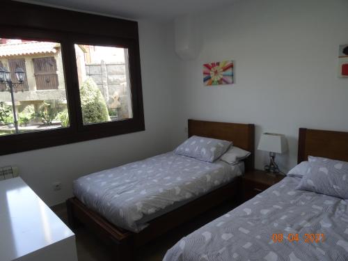 A bed or beds in a room at Apartamentos Casa Manolo