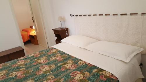 En eller flere senge i et værelse på Il Giardino del Nespolo