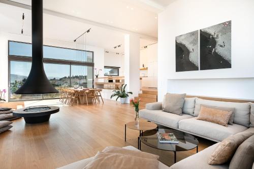 a living room with a couch and a table at Seametry Luxury Living Penthouse in Souda