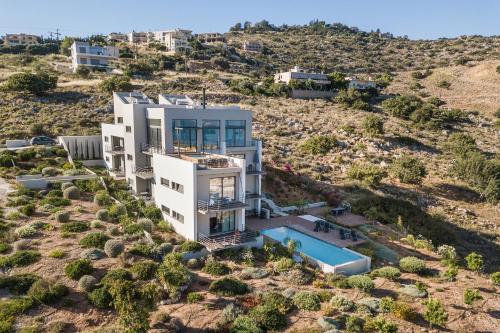 an aerial view of a house with a swimming pool at Seametry Luxury Living Penthouse in Souda