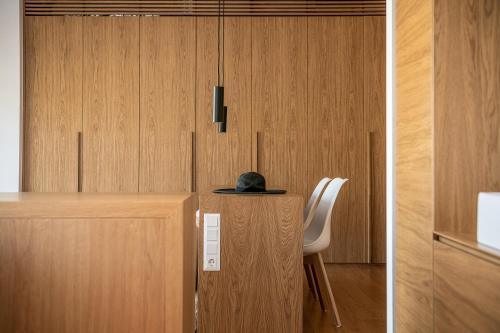 a desk with a chair and a hat on top of it at Seametry Luxury Living Penthouse in Souda