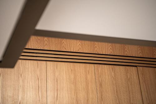 a close up of a wooden door in a room at Seametry Luxury Living Penthouse in Souda