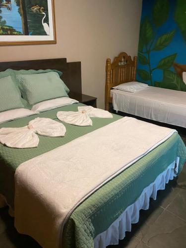 Cama o camas de una habitación en Jungle Spa e Hotel