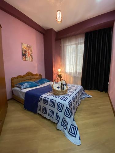 A bed or beds in a room at Metta Tbilisi Apartment