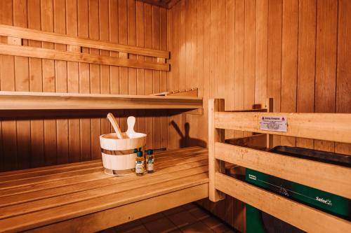 a sauna with wood paneled walls and wooden shelves at XXL Ferienhaus Goldberger See - Sauna - 16 Personen in Goldberg